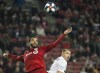Toronto FC forward Jordan Hamilton, left, eyes then ball against D.C. United midfielder Russell Canouse, right, during second half MLS soccer action in Toronto on Wednesday, May 15, 2019. Toronto FC has traded Canadian international Jordan Hamilton to Columbus Crew SC for American forward Patrick Mullins. THE CANADIAN PRESS/Nathan Denette
