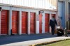 Company security staff walk past storage lockers in Winnipeg on October 21, 2014. A lawyer for a woman charged with concealing the remains of six infants in a storage locker says her upcoming trial is likely to hinge on whether the babies were born alive. THE CANADIAN PRESS/John Woods