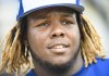 Toronto Blue Jays infielder Vladimir Guerrero Jr. (27) looks on at practice during baseball spring training in Dunedin, Fla., on Monday, February 18, 2019. Toronto's top prospect Guerrero Jr. is expected make his long awaited Major League Baseball debut when the Blue Jays play the Oakland Athletics on Friday at the Rogers Centre.THE CANADIAN PRESS/Nathan Denette
