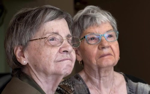 Cecile Dionne, left, and her sister Annette are seen Thursday, May 18, 2017 in St-Bruno, Que. Annette and Cecile Dionne admit they don't know much about the online world of pint-sized content creators dubbed 