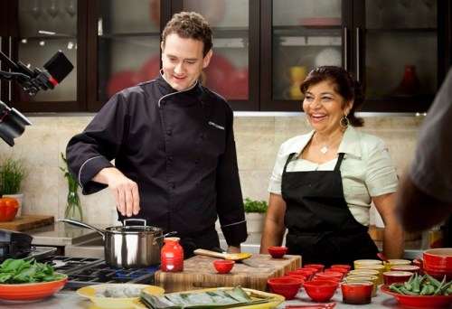 Royal Ontario Museum Chef Corbin Tomaszeski cooks alongside Rozanne Persad, owner of Curry & Roti Restaurant in Scarborough, Ont. in the 
