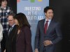 Prime Minister Justin Trudeau, right, arrives for a speech to students at Alma College, Thursday, April 4, 2019 in Alma Que. Lac St-Jean MP Richard Hebert, left, leads the way. The official campaign may be in its infancy, but over the summer Liberal politicians were already hard at work, roaming the country and making hundreds of spending announcements in Canadian ridings. THE CANADIAN PRESS/Jacques Boissinot