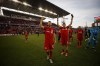 Toronto FC midfielder Jonathan Osorio (21) and teammate Marco Delgado (8) celebrate towards fans after MLS soccer action against the Columbus Crew SC, in Toronto on October 6, 2019. Champions two years ago but playoff spectators a year ago, Toronto FC returns to the MLS post-season Saturday against visiting D.C. United and Wayne Rooney. On paper, it's a close call. The two teams have identical records with Toronto holding a slightly better goal difference. But Toronto hopes home-field advantage will play its part. THE CANADIAN PRESS/ Cole Burston
