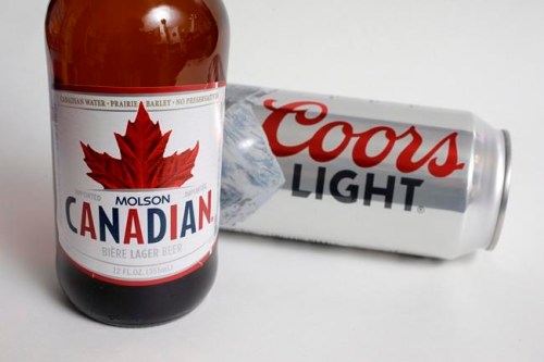 Molson Coors products Molson Canadian beer, left, and Coors Light beer are shown in Walpole, Mass., on November 28, 2017. THE CANADIAN PRESS/AP, Steven Senne