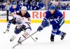Edmonton Oilers centre Connor McDavid (97) tries to manoevre the puck around Toronto Maple Leafs defenceman Ron Hainsey (2) during first period NHL action in Toronto, Wednesday, Feb. 27, 2019. The Ottawa Senators added a veteran voice to their young blue line in free agency Monday, signing defenceman Ron Hainsey to a one-year contract worth US$3.5 million. THE CANADIAN PRESS/Nathan Denette