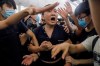 Protesters detain a man, who protesters claimed was a Chinese undercover agent during a demonstration at the Airport in Hong Kong, Tuesday, Aug. 13, 2019.The federal government is warning Canadians about travelling to Hong Kong amid massive protests and the Chinese military amassing on the border.The travel advisory went up around 9:30 ET this morning telling Canadians to 