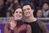 Ice dance gold medalists Canada's Tessa Virtue and Scott Moir look up to the crowd during victory ceremonies at the Pyeongchang Winter Olympics Tuesday, February 20, 2018 in Gangneung, South Korea. Not even Ellen DeGeneres could get Canadian ice dance sensations Tessa Virtue and Scott Moir to say they are more than friends. THE CANADIAN PRESS/Paul Chiasson