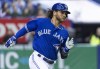 Toronto Blue Jays' Bo Bichette hustles to first for a single off Milwaukee Brewers relief pitcher Alex Claudio during the seventh inning of a spring training baseball game in Montreal on Monday, March 25, 2019. Bo Bichette looked the part of a major league shortstop when he stepped to the plate at Sahlen Field for batting practice this week. THE CANADIAN PRESS/Paul Chiasson