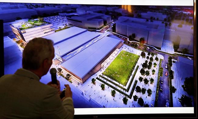 Lance Lopes, Project Manager for NHL Seattle, displays artist's renditions of a planned NHL ice hockey practice facility at Northgate Mall during a news conference in Seattle on October 8, 2018. The NHL board of governors is expected to approve expansion to Seattle today. If the vote through, Seattle will pay a $650-million expansion fee to become the league's 32nd franchise. THE CANADIAN PRESS/AP, Elaine Thompson