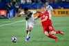 LA Galaxy defender Julian Araujo, left, and Toronto FC midfielder Jacob Shaffelburg vie for the ball during the second half of an MLS soccer match in Carson, Calif., on July 4, 2019. Teenage winger Jacob Shaffelburg has come out of nowhere this season for Toronto FC, which continues its run of games against Eastern Conference opposition when it visits the New York Red Bulls on Saturday. The Galaxy won 2-0. THE CANADIAN PRESS/AP, Ringo H.W. Chiu