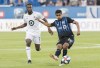 Montreal Impact's Shamit Shome, right, plays a pass as Minnesota United's Kevin Molino moves in during first half MLS soccer action in Montreal, Saturday, July 6, 2019. Alberta-born Impact player Shamit Shome has strong ties to the CPL's Cavalry FC. Shome says Cavalry coach Tommy Wheeldon jumpstarted his soccer career. Montreal plays Cavalry in the Canadian Championship semifinal on Wednesday. THE CANADIAN PRESS/Graham Hughes