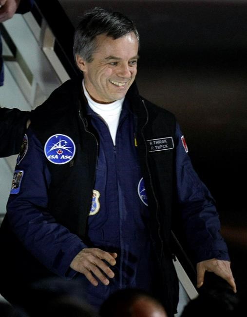 Canadian astronaut Robert Thirsk smiles as he arrival at the Star City, outside Moscow, Russia, Wednesday, Dec. 2, 2009. The Canadian Space Agency wants to hire former astronaut Thirsk to help it figure out how to contribute medical expertise to a human mission to Mars. THE CANADIAN PRESS/AP/Misha Japaridze