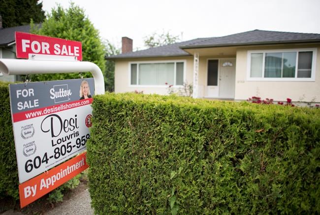 A real estate sign is pictured in Vancouver, B.C., Tuesday, June, 12, 2018. THE CANADIAN PRESS Jonathan Hayward