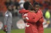 Canada's Jonathan David, right, celebrates his goal against Dominica with teammate Alphonso Davies during first half CONCACAF Nations League qualifier soccer action in Toronto on Tuesday, October 16, 2018. David is looking to add his offensive firepower to the Canadian men's team when they play French Guiana in a CONCACAF Nations League qualifier in Vancouver on Sunday.THE CANADIAN PRESS/Nathan Denette