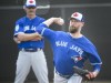 Toronto Blue Jays pitcher John Axford, right, throws a bullpen session as Blue Jays pitching coach Pete Walker looks on during baseball spring training in Dunedin, Fla., on Wednesday, February 20, 2019. The Toronto Blue Jays have re-signed Canadian reliever John Axford to a minor-league deal. THE CANADIAN PRESS/Nathan Denette