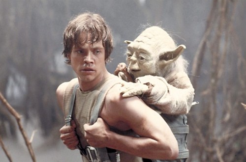Mark Hamill as Luke Skywalker and the character Yoda appear in this scene from 