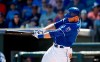 Kansas City Royals' Michael Saunders connects for a three-run double against the San Diego Padres during the third inning of a spring training baseball game in Surprise, Ariz., on March 12, 2018. Michael Saunders was convinced his playing days were over after he was released by the Colorado Rockies last spring training. But a phone call from Baseball Canada's director of national teams lured the former Blue Jays all-star back for one last tournament before officially calling it quits. THE CANADIAN PRESS/AP, Ross D. Franklin