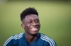 Vancouver Whitecaps midfielder Alphonso Davies laughs while talking to a teammate as he waits to begin an interview after MLS soccer practice in Vancouver, on Wednesday October 24, 2018. Canadian teenager Davies could make his Bundesliga debut Friday when Bayern Munich visits Hoffenheim as the German league resumes following its traditional winter break. THE CANADIAN PRESS/Darryl Dyck
