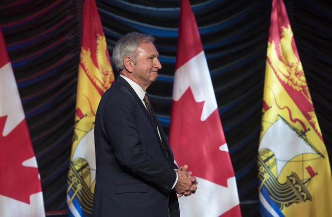 New Brunswick Premier Blaine Higgs walks onto stage to deliver the State of the Province address in Fredericton on Thursday January 31, 2019. New Brunswick's Progressive Conservative premier says voters delivered a message Monday on the federal carbon tax, and his province will have to find a way to make it work. THE CANADIAN PRESS/Stephen MacGillivray