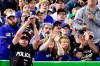 In this May 14, 2017, file photo, a police officer tries to catch a foul ball during seventh inning of a baseball game between the Toronto Blue Jays and Seattle Mariners in Toronto. The Toronto Blue Jays say they will extend the protective netting at the Rogers Centre and Dunedin Stadium ??? their home for spring training in Florida ??? next season. THE CANADIAN PRESS/Frank Gunn