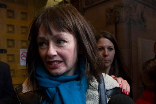 Lucy DeCoutere leaves the Toronto courthouse following the reading of the verdict in the Jian Ghomeshi sexual assault trial on Thursday, March 24, 2016. Former 