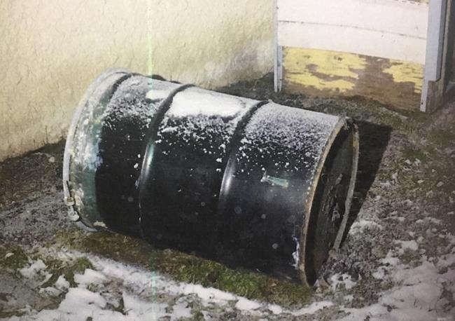 A barrel is seen in a Winnipeg yard in this undated handout photo provided by Manitoba Court of Queen's Bench. Perez Cleveland, 46, has pleaded not guilty in the death of 42-year-old Jennifer Barrett, whose body was found in a barrel behind their Winnipeg home in December 2016. THE CANADIAN PRESS/HO, Manitoba Court of Queen's Bench *MANDATORY CREDIT*