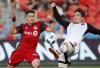 Toronto FC's Marco Delgado battles for the ball with Ottawa Fury FC's Thomas Meilleur-Giguere, right, during the first half of Canadian Championship soccer action in Toronto, Wednesday July 25, 2018. Ottawa Fury FC's sanctioning battle with CONCACAF appears to be over - for the time being. THE CANADIAN PRESS/Mark Blinch