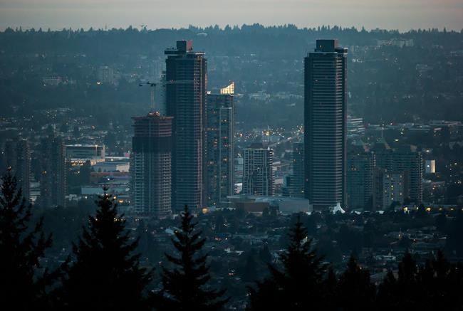 Experts say a pair of Liberal proposals to make home ownership more attainable would have a subdued impact, particularly in markets like Vancouver, Victoria and the Greater Toronto Area where property prices continue to soar beyond the reach of many residents. Condo towers under construction are seen in the Brentwood area of Burnaby, B.C., at dusk on Saturday, Aug. 3, 2019. THE CANADIAN PRESS/Darryl Dyck