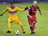 Toronto FC midfielder Michael Bradley (4) makes a pass under pressure from UANL Tigres midfielder Larry Vasquez (19) during first half CONCACAF Champions League quarter-final action, in Toronto on Wednesday, March 7, 2018. Toronto FC offers a taste Tuesday of what lies ahead in 2019 when the MLS side kicks off its competitive season in Panama in a Scotiabank CONCACAF Champions League round-of-16 game against Club Atletico Independiente de la Chorrera. THE CANADIAN PRESS/Frank Gunn