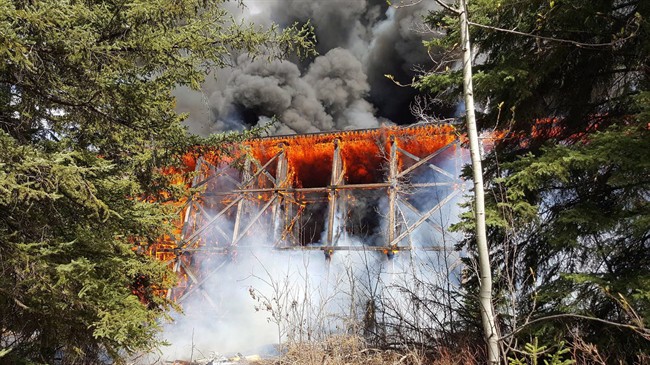 Fire engulfs a Canadian National Railway bridge on the outskirts of Mayerthorpe in this image provide by the Town of Mayerthorpe, Alta., on April 26, 2016. THE CANADIAN PRESS/HO-Town of Mayerthorpe