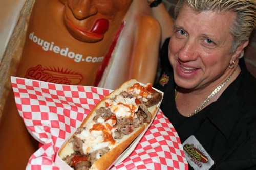 Dougie Luv, owner of Vancouver's DougieDog Hot Dogs and inventor of the $100 hot dog, is shown in a handout photo. A Vancouver eatery is billing its new Dragon Dog as the most expensive hotdog in the world. DougieDog Hot Dogs says the footlong creation is 