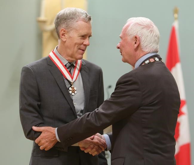 Author and humourist Stuart McLean is presented with the Officer of the Order of Canada medal by Governor General David Johnston in Ottawa on Friday, September 28, 2012. The Vinyl Cafe