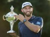 Dustin Johnson, of the United States, hoists the Canadian Open championship trophy at the Glen Abbey Golf Club in Oakville Ont., on Sunday, July 29, 2018.The RBC Canadian Open is less than a month away and already it's shaping up to be one of the most competitive fields in the storied tournament's recent history. THE CANADIAN PRESS/Nathan Denette