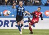 Toronto FC's Sebastian Giovinco, right, takes a shot on goal as Montreal Impact's Samuel Piette defends during second half MLS soccer action in Montreal on October 21, 2018. As residents of their city dig themselves out of an arctic winter blast, the Montreal Impact are escaping to warmer pastures. The one catch is, they'll need to be fit. 