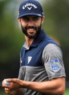 Adam Hadwin carries his ball after putting on the ninth hole during the BMW Championship golf tournament in Medinah, Ill., Friday, Aug. 16, 2019. It's been two years since Canadian golfer Hadwin played in the Presidents Cup and he's wanted to return to it ever since.THE CANADIAN PRESS/AP-Joe Lewnard/Daily Herald via AP