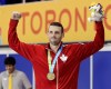 Ryan Cochrane of Canada poses with his gold medal for the men's 1500 meter freestyle swimming event at the Pan Am Games Saturday, July 18, 2015, in Toronto. Cochrane admits that in the past he might have been searching for a level of perfection that wasn't there.THE CANADIAN PRESS/AP /Mark Humphrey