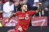 Toronto FC's Sebastian Giovinco celebrates his penalty kick goal against the Chicago Fire during first half MLS soccer action in Toronto, Sunday, October 23, 2016. While his former Toronto FC teammates trained in California, a smiling Sebastian Giovinco was introduced 13,300 kilometres away to his new fans in Saudi Arabia. THE CANADIAN PRESS/Frank Gunn