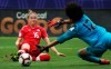 Canada forward Janine Beckie (16) scores a goal on Panama goalkeeper Farissa Cordoba (12) during the second half of a CONCACAF women's World Cup qualifying tournament soccer match in Frisco, Texas, Sunday, Oct. 14, 2018. Canadian international forward Janine Beckie has signed a one-year contract extension with Manchester City. THE CANADIAN PRESS/AP, Andy Jacobsohn