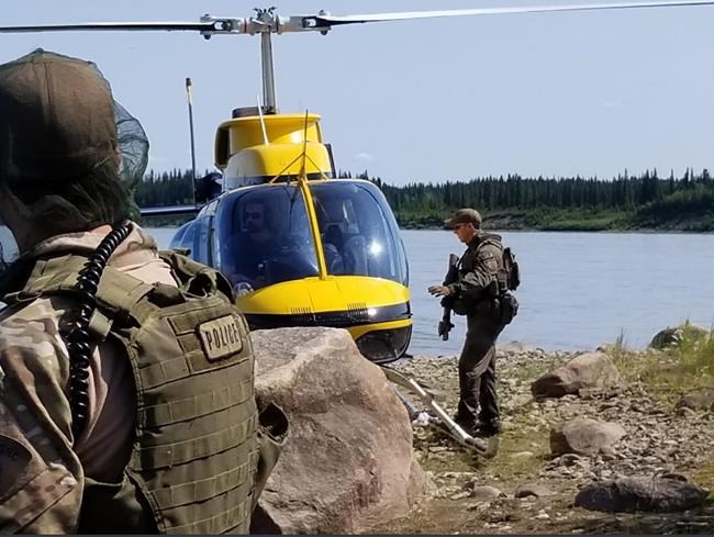RCMP search an area near Gillam, Man. in this photo posted to their Twitter page on Tuesday, July 30, 2019. Officers are in the Gillam area to search for 18-year-old Bryer Schmegelsky and his 19-year-old friend Kam McLeod. The teens are charged with second-degree murder in the death of one man and are suspects in the fatal shootings of a young couple.THE CANADIAN PRESS/HO, Twitter, Manitoba RCMP, @rcmpmb *MANDATORY CREDIT*