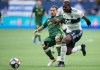 Vancouver Whitecaps' Doneil Henry, front right, and Portland Timbers' Sebastian Blanco vie for the ball during the first half of an MLS soccer game in Vancouver on Friday May 10, 2019. Vancouver Whitecaps coach Marc Dos Santos isn't surprised at the injury bug spreading through his roster. After all, it's been a hectic month for the Whitecaps (3-6-4). THE CANADIAN PRESS/Darryl Dyck