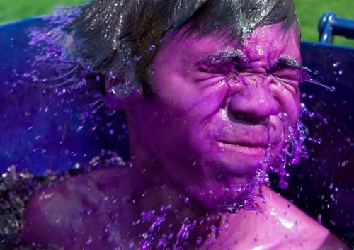 Jeromy Choi, a fifth year engineering student at the University of Ottawa, shakes off excess dye submerging himself in the purple dye, an engineering tradition during the start of Frosh week at the University of Ottawa in Ottawa on Sept 5, 2010. Health Canada says a dye often used to stain engineering students' skin purple has been linked to a possible cancer risk. THE CANADIAN PRESS/Pawel Dwulit