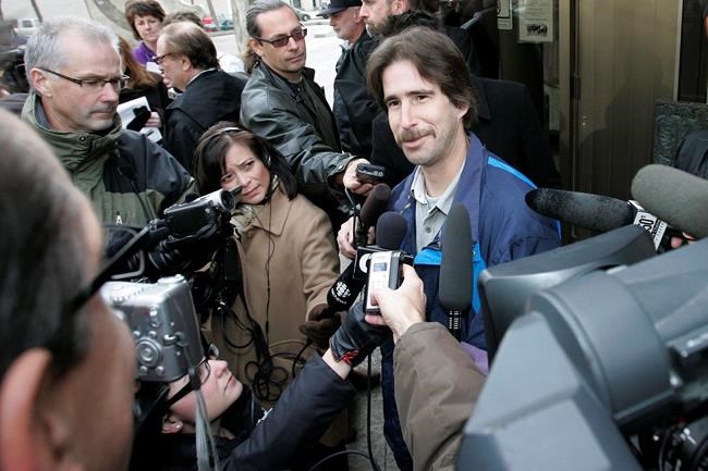 Kyle Unger smiles as he talks to media outside a Winnipeg courthouse on October 23, 2009. Kyle Unger spent 14 years in prison for the grisly slaying of a teenage girl before his case was deemed a likely wrongful conviction and he was acquitted. On Monday, almost 29 years after the killing, the Manitoba government said it had settled a multi-million-dollar lawsuit brought by Unger, now in his late 40s.