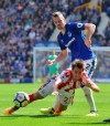Stoke City's Bojan Krkic, left, and Everton's Morgan Schneiderlin in action during the English Premier League soccer match at Goodison Park, Liverpool, England, Saturday, Aug. 12, 2017. When you've played alongside Lionel Messi, Thierry Henry and Francesco Totti, anything else may feel like a step down. But that's not how Bojan Krkic sees his move to Major League Soccer. The Montreal Impact signed the 28-year-old attacking midfielder through the end of the 2020 season at the MLS summer trade deadline day on Wednesday. THE CANADIAN PRESS/Anthony Devlin/PA via AP