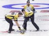 Manitoba skip Reid Carruthers looks on as second Derek Samagalski, left, and lead Colin Hodgson sweep against Nunavut at the Tim Hortons Brier curling championship at the Brandt Centre in Regina on March 4, 2018. Armed with a passionate fanbase, an ever-growing list of elite competitors, a surge in interest after a memorable Winter Olympics and growing penetration in enviable international markets, the sport of curling appears primed for a breakout. Whether the opportunity will be harvested remains up in the air. THE CANADIAN PRESS/Andrew Vaughan