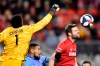 Toronto FC defender Drew Moor (3, New York City defender Alexander Callens (6) and New York City goalkeeper Sean Johnson (1) battle in the air during first half MLS action in Toronto on March 29, 2019. THE CANADIAN PRESS/Frank Gunn