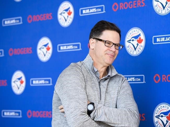 Toronto Blue Jays general manager Ross Atkins looks on after speaking to the media during baseball spring training in Dunedin, Fla., on Thursday, February 14, 2019. Atkins weighed in Tuesday after the team took a lashing from fans and local media after star attraction Vladimir Guerrero Jr., sat out the holiday Monday matinee against the Red Sox. THE CANADIAN PRESS/Nathan Denette
