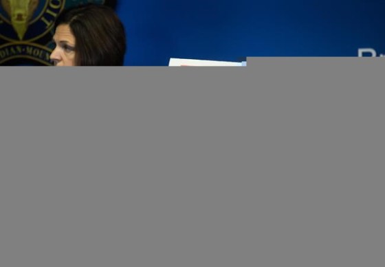 Security camera images recorded in Saskatchewan of Kam McLeod, 19, and Bryer Schmegelsky, 18, are displayed as RCMP Sgt. Janelle Shoihet listens during a news conference in Surrey, B.C., on July 23, 2019. The RCMP will release its investigative findings on Friday into the killing of three people in northern British Columbia that sparked a manhunt for two teenage suspects across Western Canada. Bryer Schmegelsky, who was 18, and Kam McLeod, who was 19, were found dead of self-inflicted gunshot wounds last month in the wilderness of northern Manitoba. Schmegelsky and McLeod were charged with the murder of Leonard Dyck, a University of British Columbia botany lecturer, and were also suspects in the deaths of American Chynna Deese and her Australian boyfriend Lucas Fowler. THE CANADIAN PRESS/Darryl Dyck