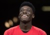 Canada's Alphonso Davies watches as his teammates warm up before a CONCACAF Nations League qualifying soccer match against French Guiana in Vancouver, on Sunday March 24, 2019. Now 18 and a season with Bayern Munich under his belt, eyes will be on Davies when Canada opens the 2019 Gold Cup on Saturday against Martinique at the Rose Bowl in Pasadena, Calif. THE CANADIAN PRESS/Darryl Dyck