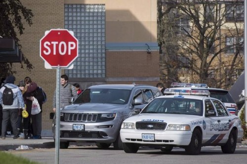 Toronto police respond to a bomb threat at St. Michael's College School, in Toronto on Monday, Nov. 19, 2018. It's been called a rite of passage, a bonding ritual, a way to initiate novice members into a fraternity, elite sports team or military unit through physical and mental challenges ??? with the aim of individuals becoming cemented into the whole. THE CANADIAN PRESS/ Tijana Martin