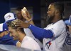 Toronto Blue Jays' Teoscar Hernandez, right, dumps sunflower seeds on Randal Grichuk during seventh inning American League baseball action against the Baltimore Orioles in Toronto on Monday, April 1, 2019. The Toronto Blue Jays have signed outfielder Randal Grichuk to a US$52-million five-year contract extension. THE CANADIAN PRESS/Nathan Denette